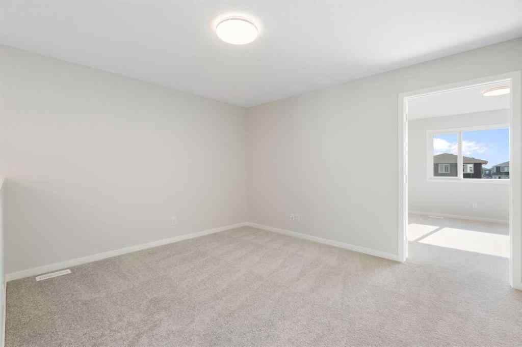 MLS® A2257737 - 34 Herron Common NE in Livingston Calgary, Residential