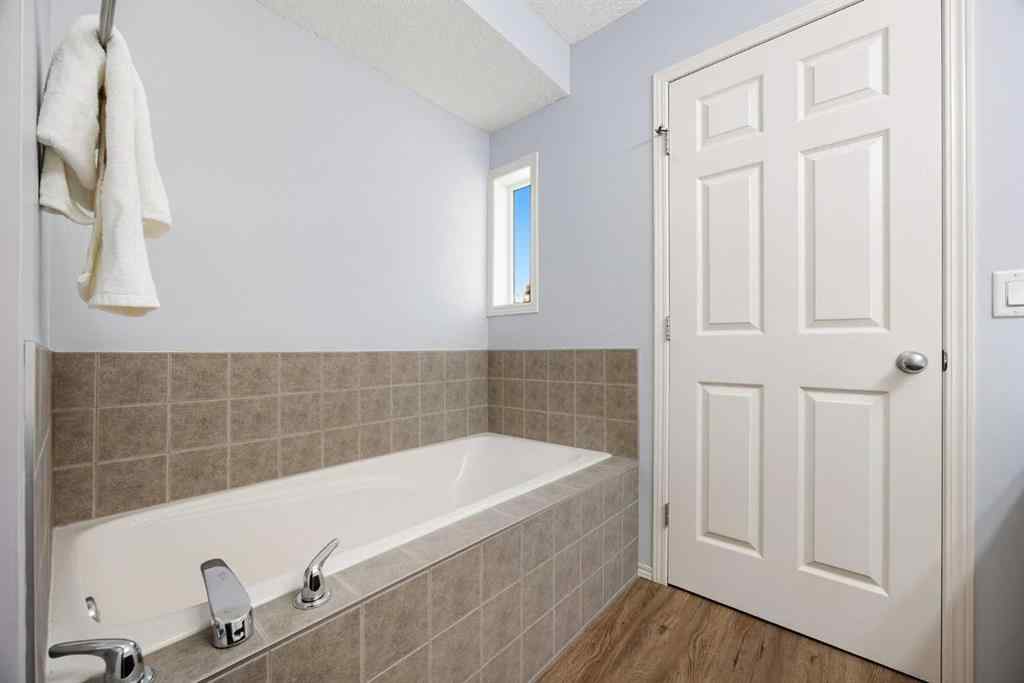 MLS® A2257755 - 703 Tuscany Drive NW in Tuscany Calgary, Residential