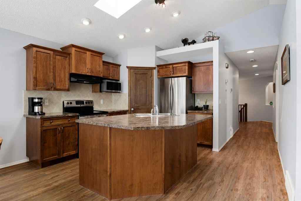 MLS® A2257755 - 703 Tuscany Drive NW in Tuscany Calgary, Residential