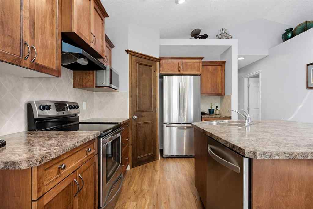 MLS® A2257755 - 703 Tuscany Drive NW in Tuscany Calgary, Residential