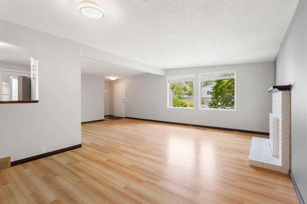 MLS® A2257762 - 703 130 Avenue SW in Canyon Meadows Calgary, Residential