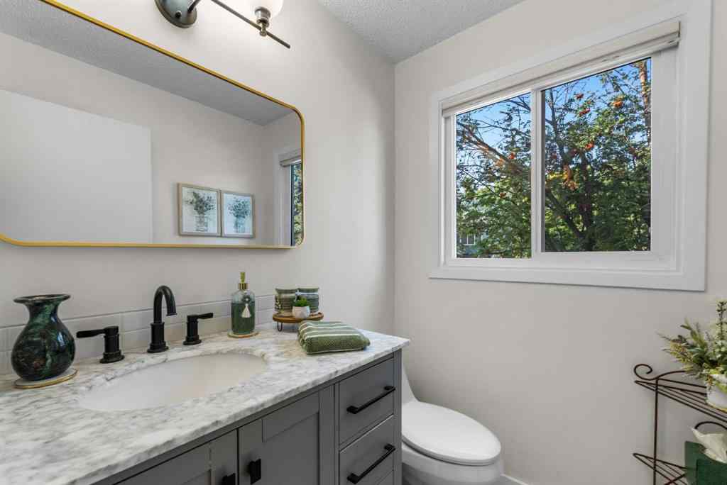 MLS® A2257844 - 210 Queenston Heights SE in Queensland Calgary, Residential