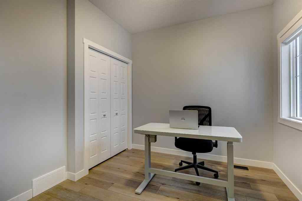 MLS® A2257906 - 878 Bluerock Way SW in Alpine Park Calgary, Residential