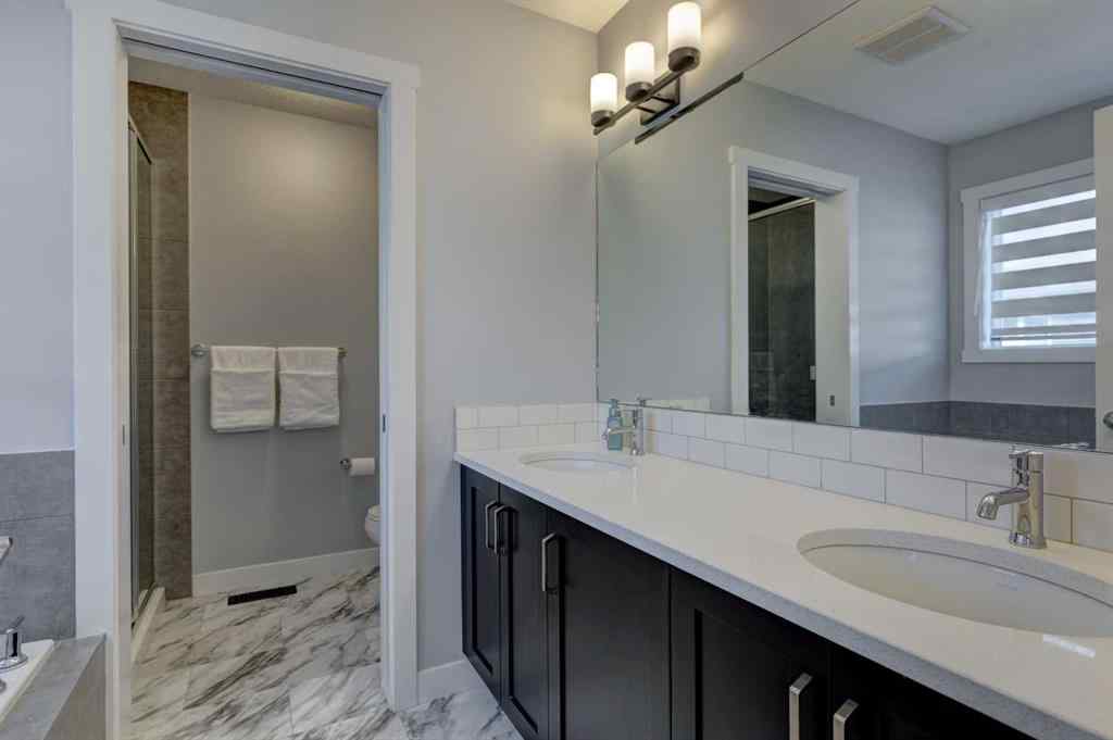 MLS® A2257906 - 878 Bluerock Way SW in Alpine Park Calgary, Residential