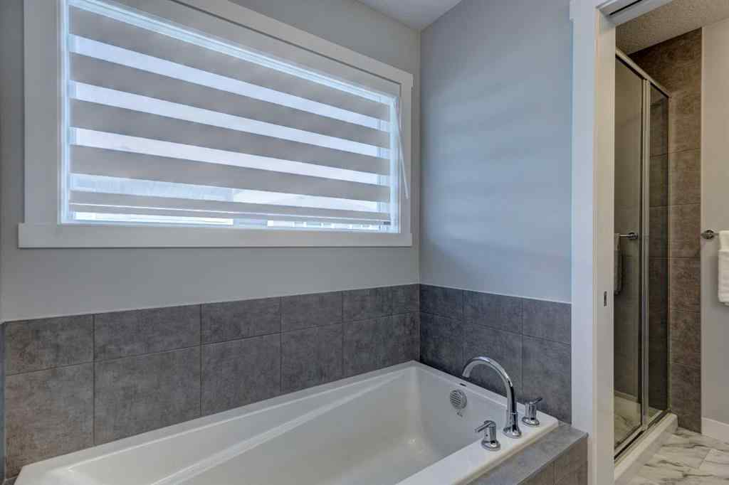 MLS® A2257906 - 878 Bluerock Way SW in Alpine Park Calgary, Residential