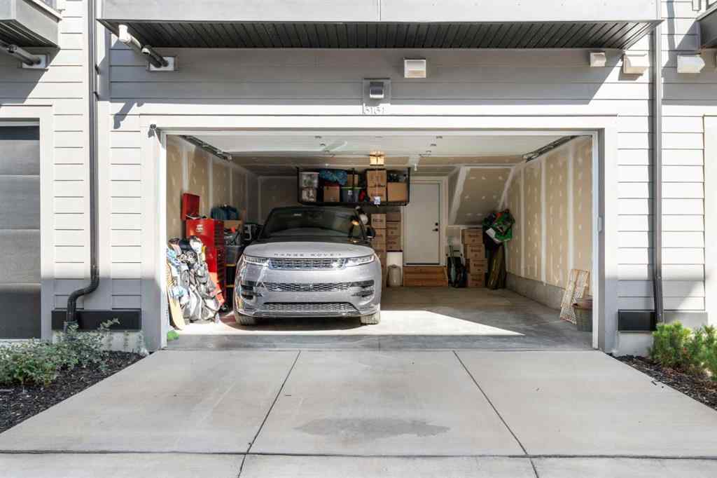 MLS® A2257907 - 8161 8 Avenue SW in West Springs Calgary, Residential