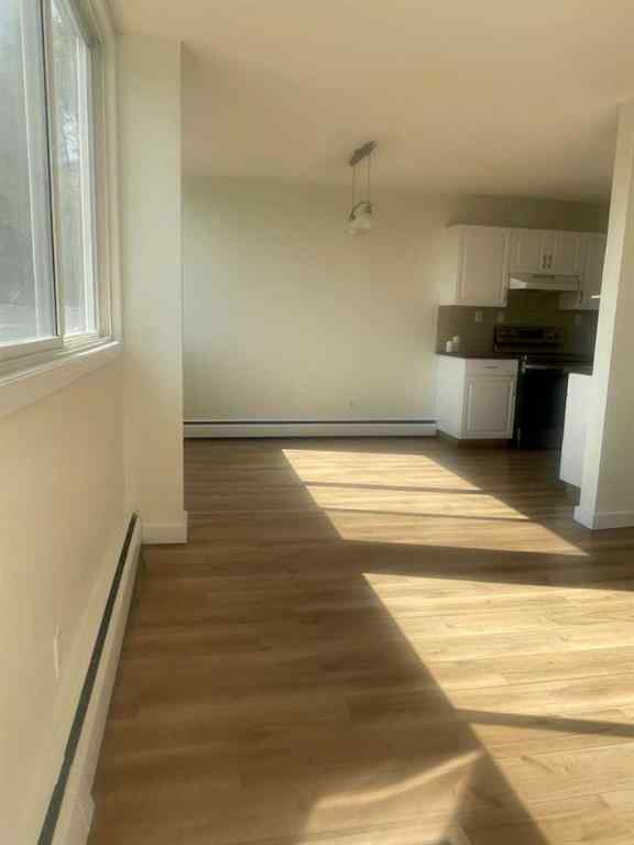 MLS® A2257943 - Unit #101 607 69 Avenue SW in Kingsland Calgary, Residential