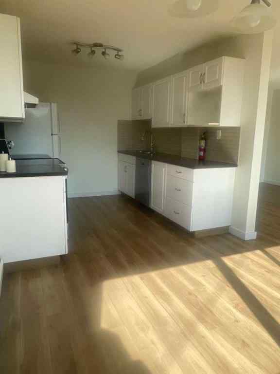 MLS® A2257943 - Unit #101 607 69 Avenue SW in Kingsland Calgary, Residential
