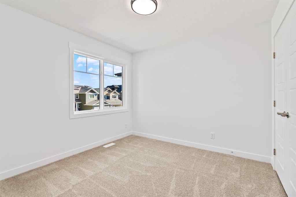 MLS® A2258100 - 121 Creekstone Landing SW in Pine Creek Calgary, Residential