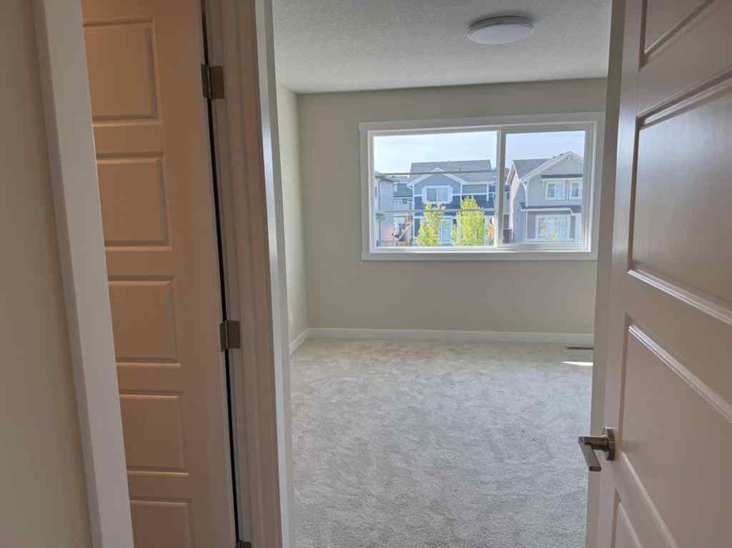 MLS® A2258128 - 318 Sundown Road  in Sunset Ridge Cochrane, Residential