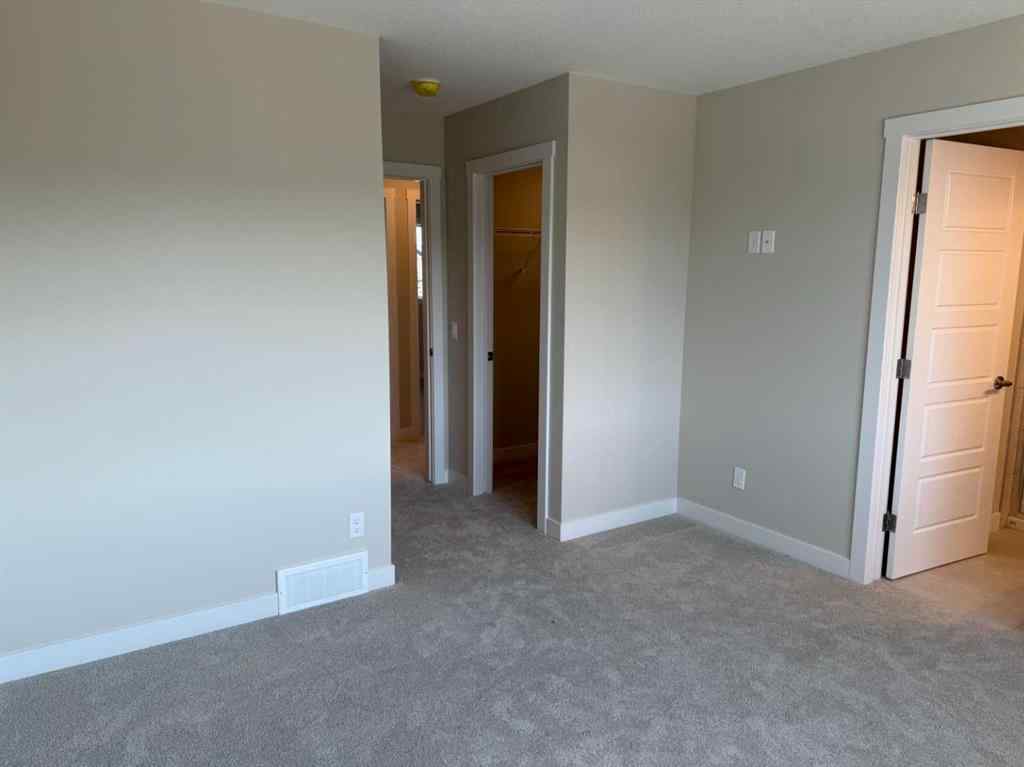 MLS® A2258128 - 318 Sundown Road  in Sunset Ridge Cochrane, Residential