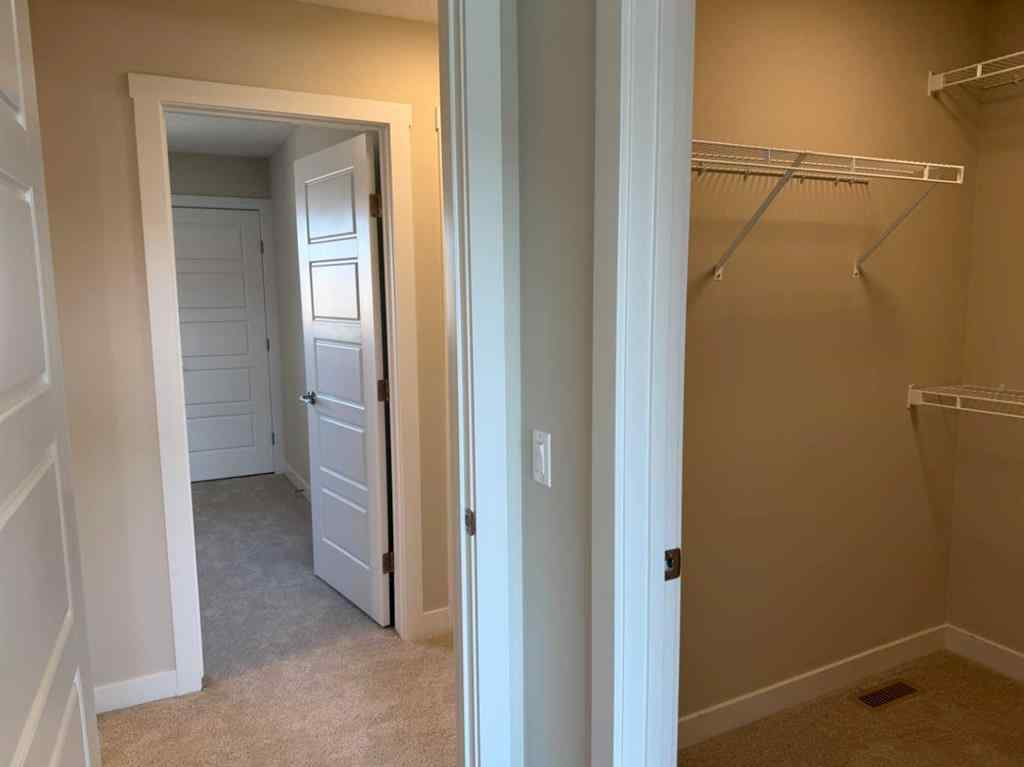 MLS® A2258128 - 318 Sundown Road  in Sunset Ridge Cochrane, Residential