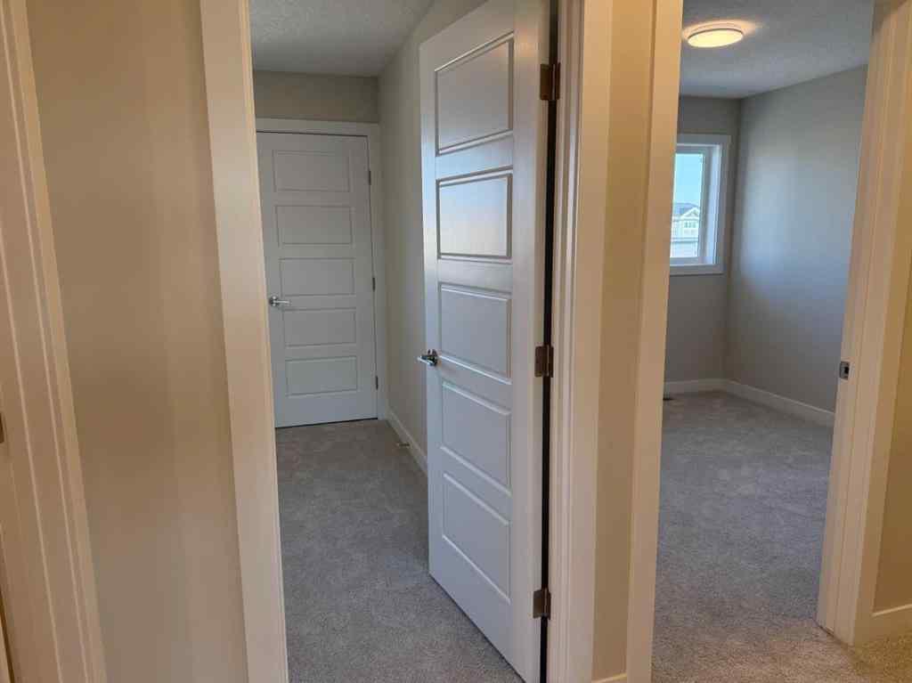MLS® A2258128 - 318 Sundown Road  in Sunset Ridge Cochrane, Residential