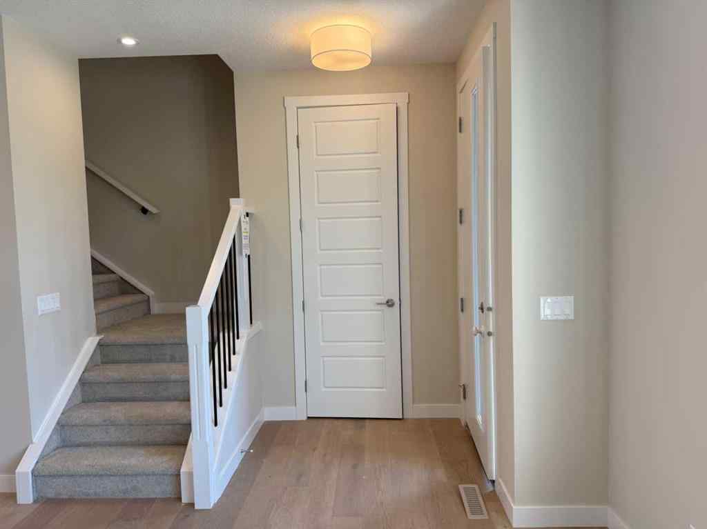 MLS® A2258128 - 318 Sundown Road  in Sunset Ridge Cochrane, Residential