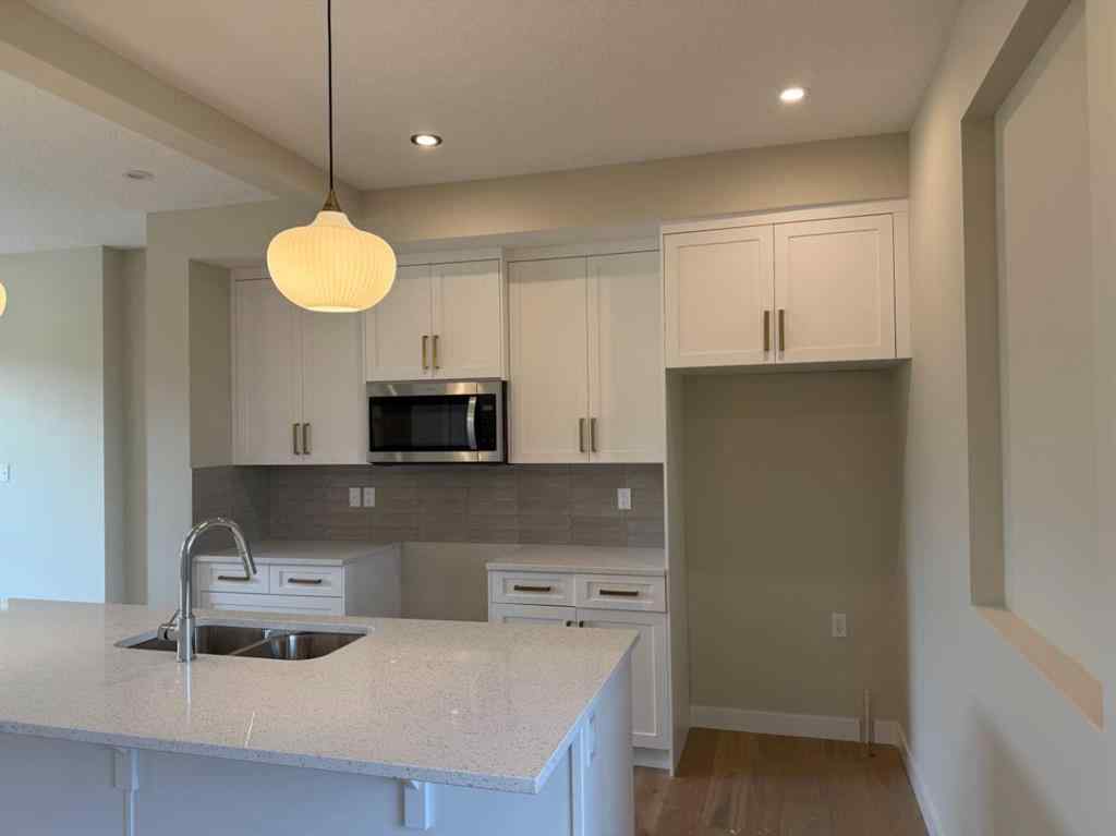 MLS® A2258128 - 318 Sundown Road  in Sunset Ridge Cochrane, Residential