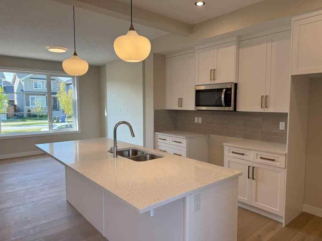 MLS® A2258128 - 318 Sundown Road  in Sunset Ridge Cochrane, Residential