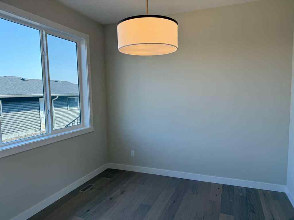 MLS® A2258128 - 318 Sundown Road  in Sunset Ridge Cochrane, Residential