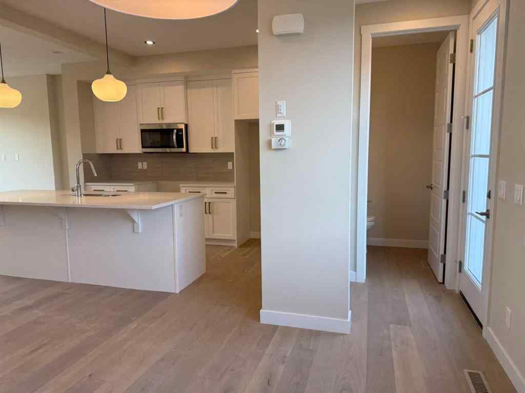 MLS® A2258128 - 318 Sundown Road  in Sunset Ridge Cochrane, Residential