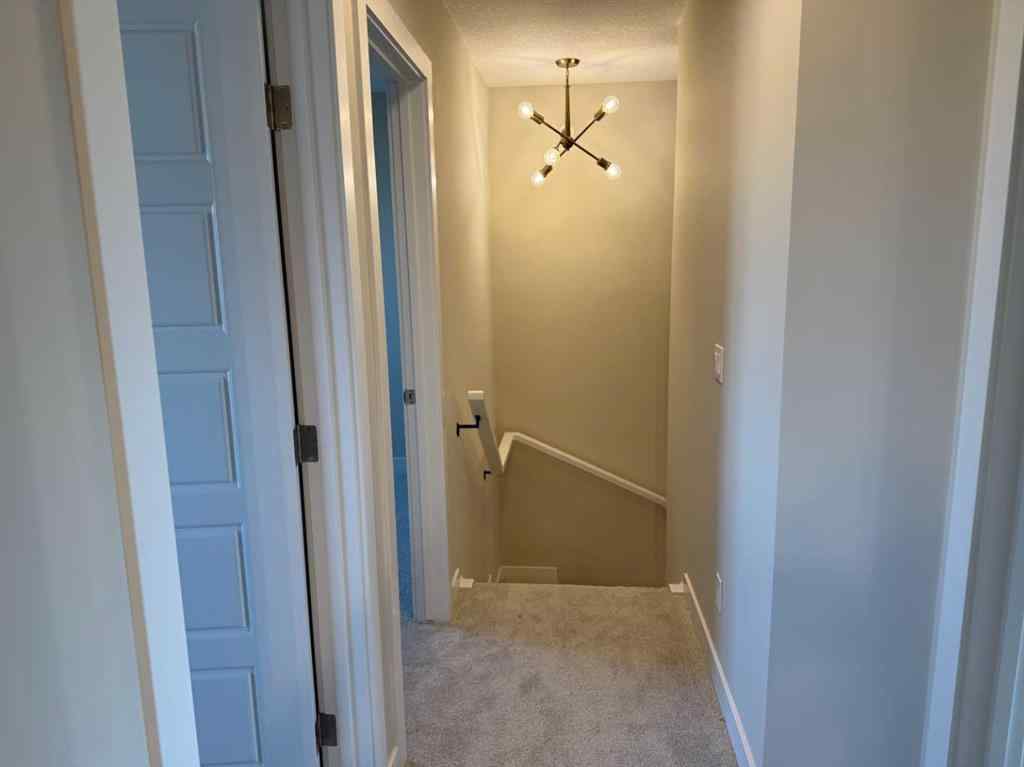 MLS® A2258128 - 318 Sundown Road  in Sunset Ridge Cochrane, Residential