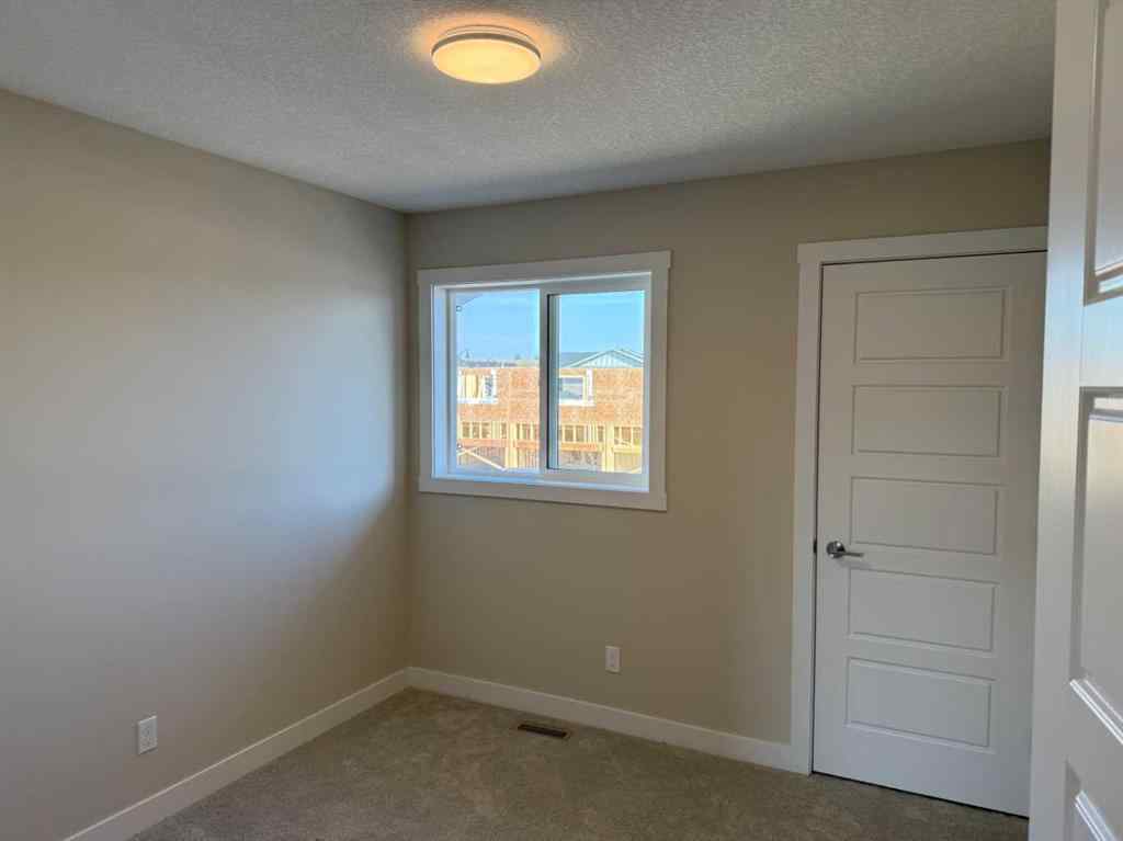 MLS® A2258128 - 318 Sundown Road  in Sunset Ridge Cochrane, Residential