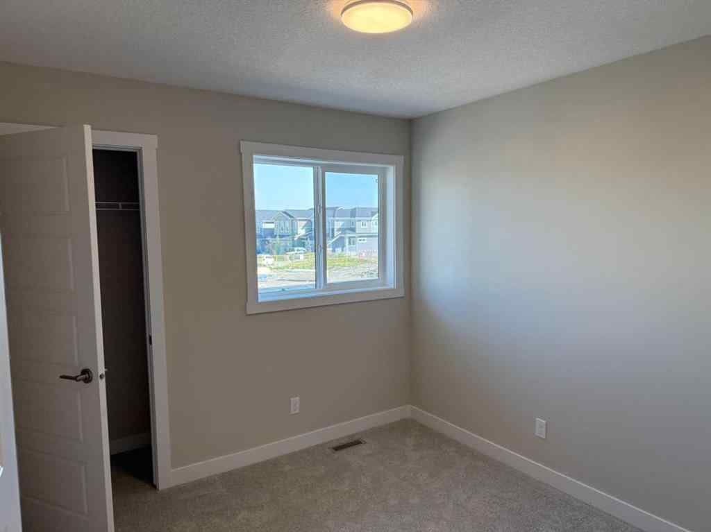 MLS® A2258128 - 318 Sundown Road  in Sunset Ridge Cochrane, Residential