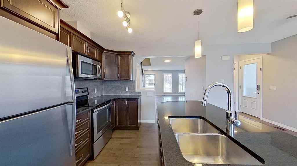 MLS® A2258304 - 63 Elgin Meadows Park SE in McKenzie Towne Calgary, Residential