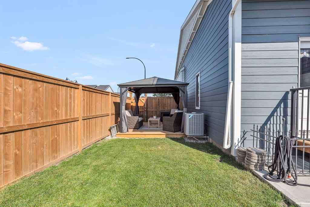 MLS® A2258347 - 1098 Creekside Boulevard SW in Pine Creek Calgary, Residential