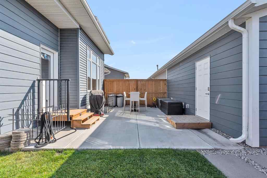 MLS® A2258347 - 1098 Creekside Boulevard SW in Pine Creek Calgary, Residential