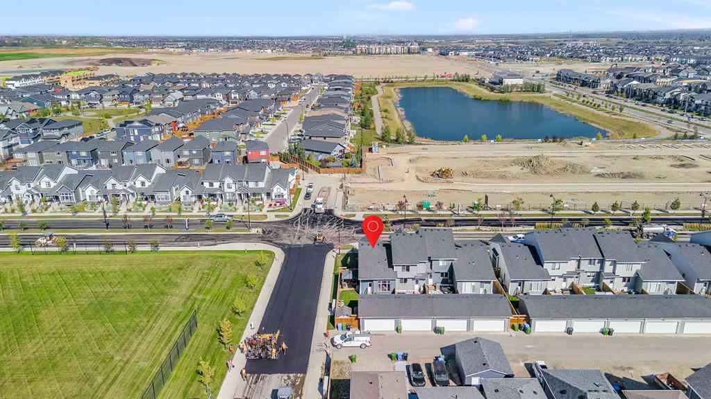 MLS® A2258347 - 1098 Creekside Boulevard SW in Pine Creek Calgary, Residential