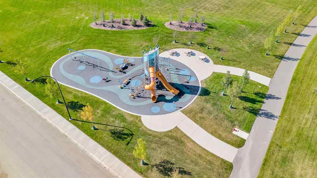 MLS® A2258347 - 1098 Creekside Boulevard SW in Pine Creek Calgary, Residential