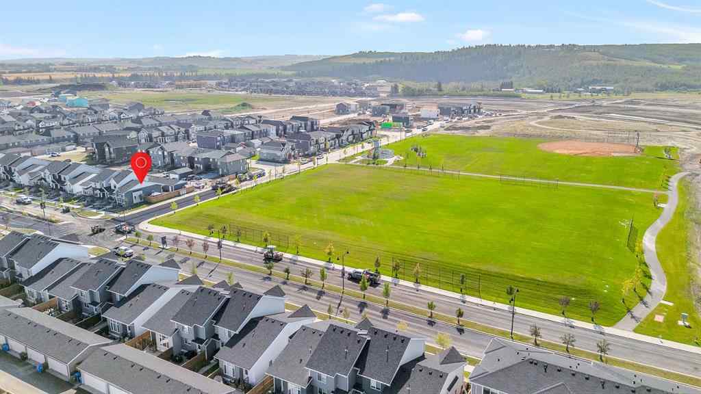 MLS® A2258347 - 1098 Creekside Boulevard SW in Pine Creek Calgary, Residential