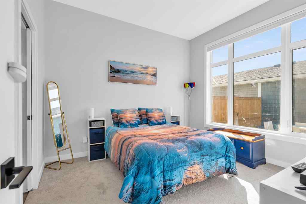 MLS® A2258347 - 1098 Creekside Boulevard SW in Pine Creek Calgary, Residential