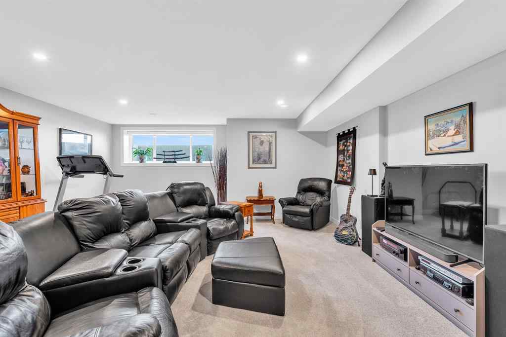 MLS® A2258347 - 1098 Creekside Boulevard SW in Pine Creek Calgary, Residential