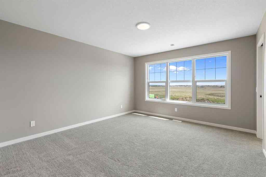 MLS® A2258581 - 415 Hotchkiss Manor SE in Hotchkiss Calgary, Residential