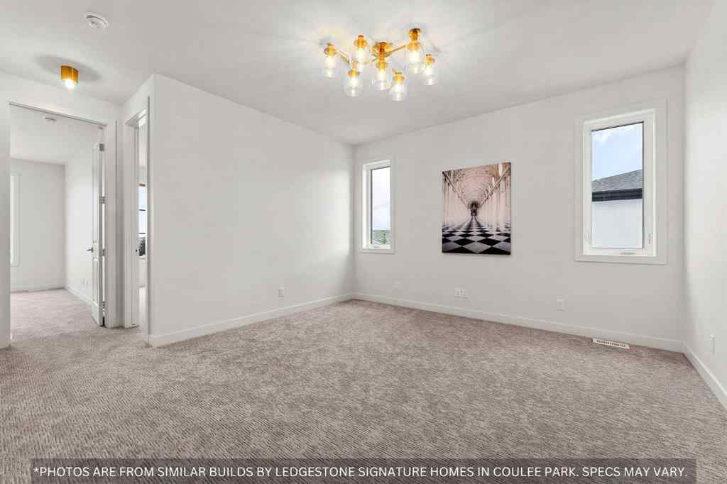MLS® A2258648 - 91 Coulee Crescent SW in Cougar Ridge Calgary, Residential