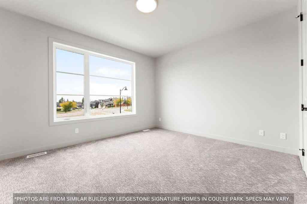MLS® A2258648 - 91 Coulee Crescent SW in Cougar Ridge Calgary, Residential