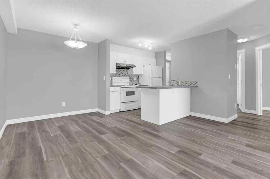 MLS® A2258662 - Unit #103 5555 Falsbridge Drive NE in Falconridge Calgary, Residential