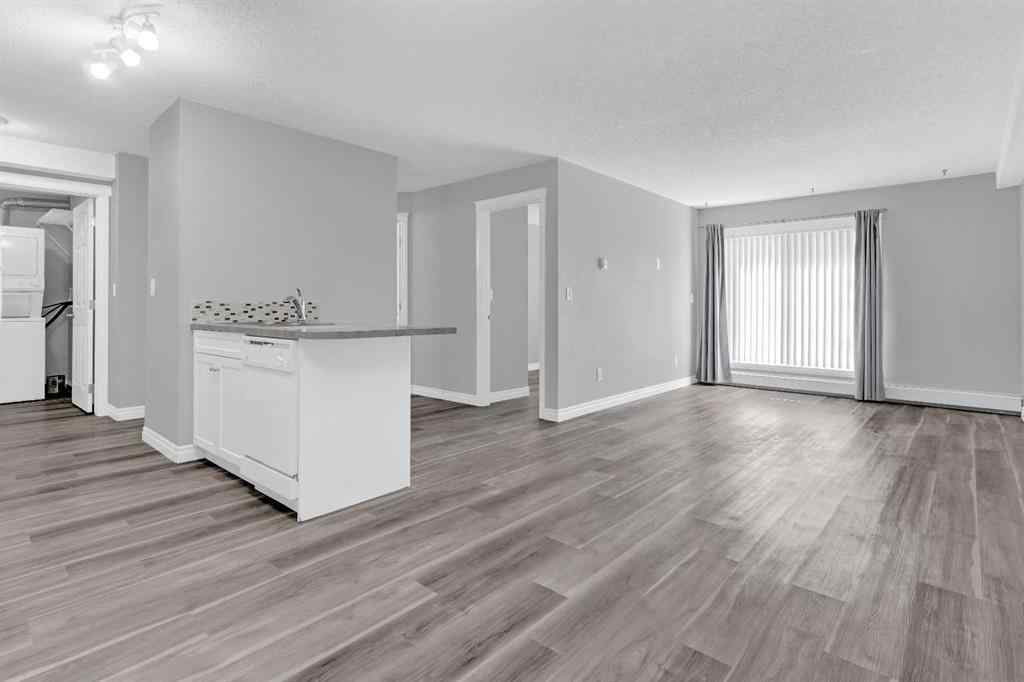 MLS® A2258662 - Unit #103 5555 Falsbridge Drive NE in Falconridge Calgary, Residential