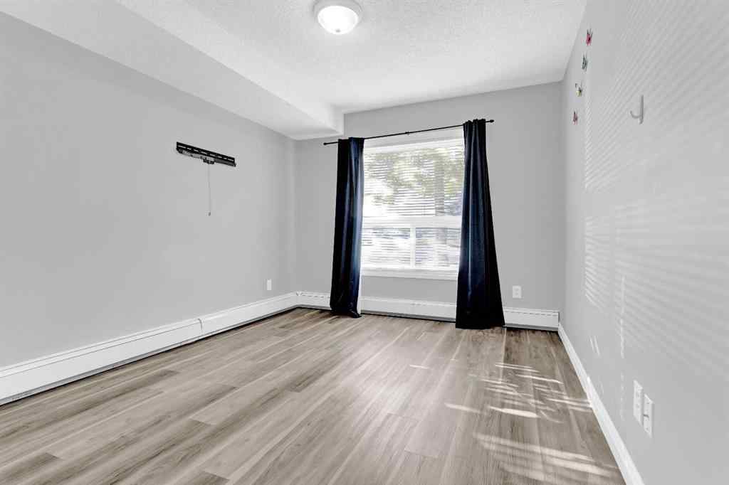 MLS® A2258662 - Unit #103 5555 Falsbridge Drive NE in Falconridge Calgary, Residential