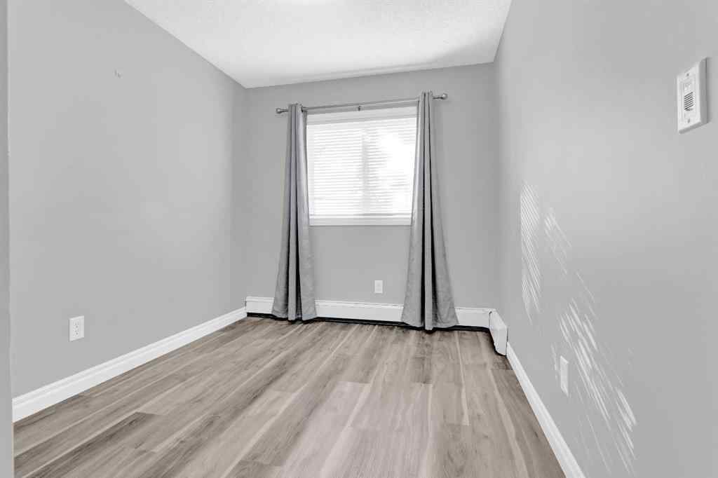 MLS® A2258662 - Unit #103 5555 Falsbridge Drive NE in Falconridge Calgary, Residential