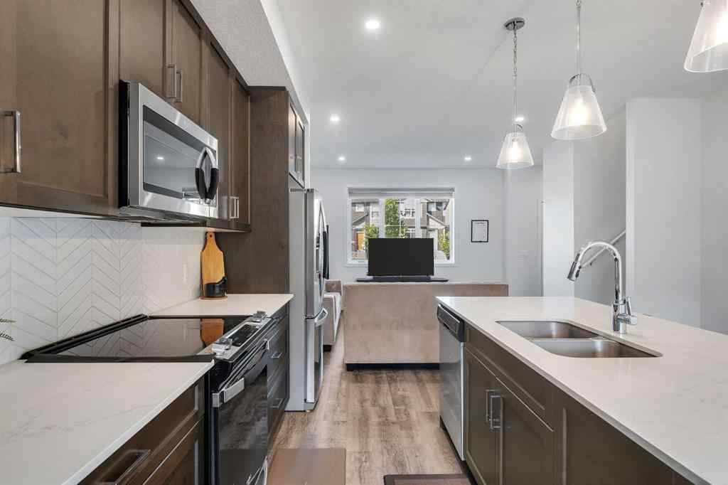 MLS® A2258813 - 72 Creekside Boulevard SW in Pine Creek Calgary, Residential