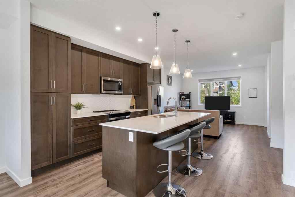 MLS® A2258813 - 72 Creekside Boulevard SW in Pine Creek Calgary, Residential
