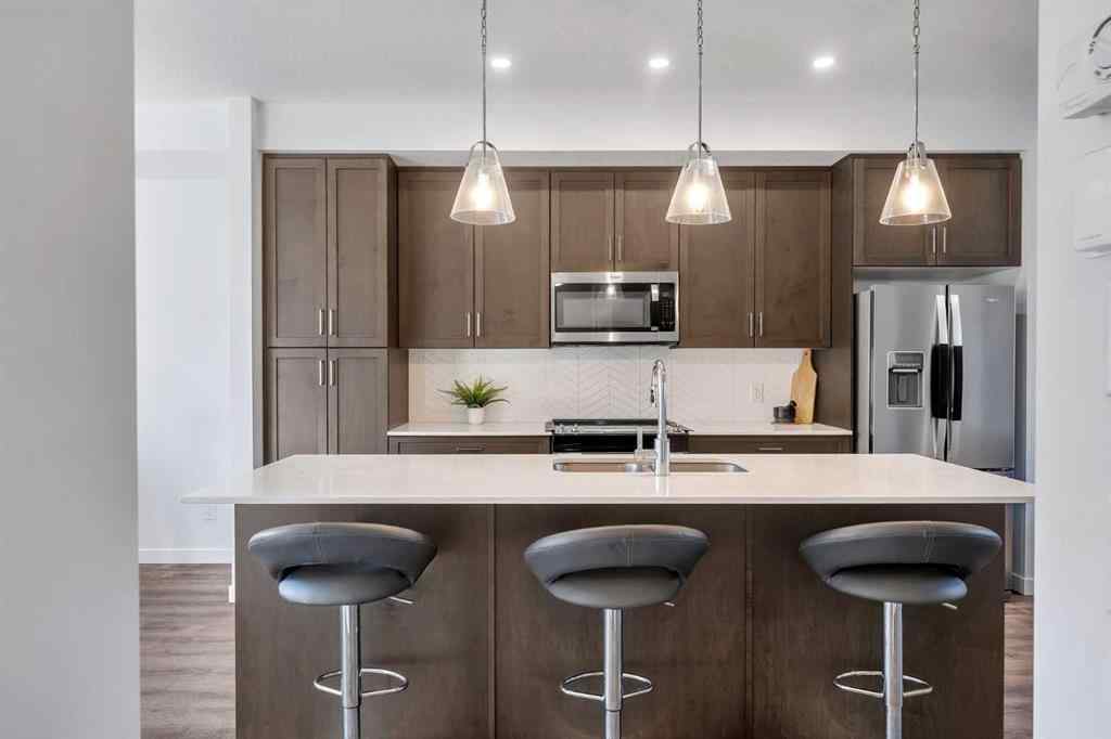 MLS® A2258813 - 72 Creekside Boulevard SW in Pine Creek Calgary, Residential