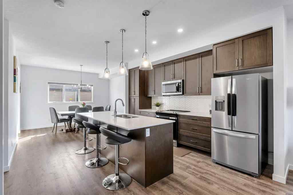 MLS® A2258813 - 72 Creekside Boulevard SW in Pine Creek Calgary, Residential