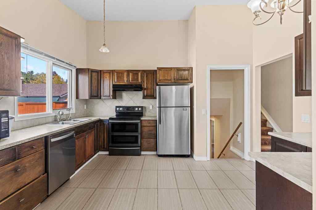 MLS® A2258825 - 212 Queen Anne Road SE in Queensland Calgary, Residential