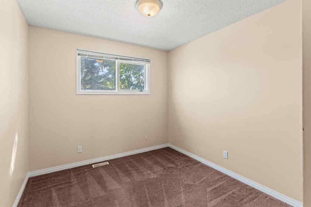 MLS® A2258825 - 212 Queen Anne Road SE in Queensland Calgary, Residential