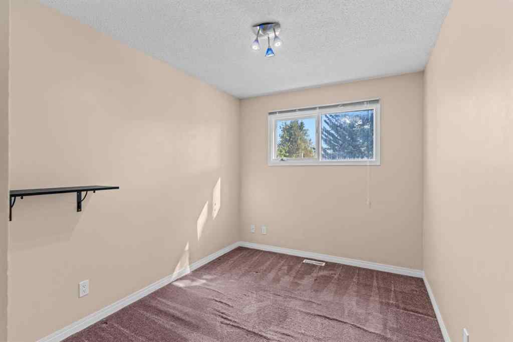MLS® A2258825 - 212 Queen Anne Road SE in Queensland Calgary, Residential