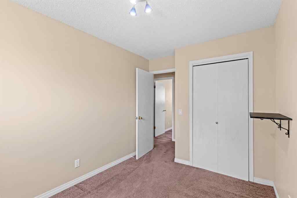 MLS® A2258825 - 212 Queen Anne Road SE in Queensland Calgary, Residential