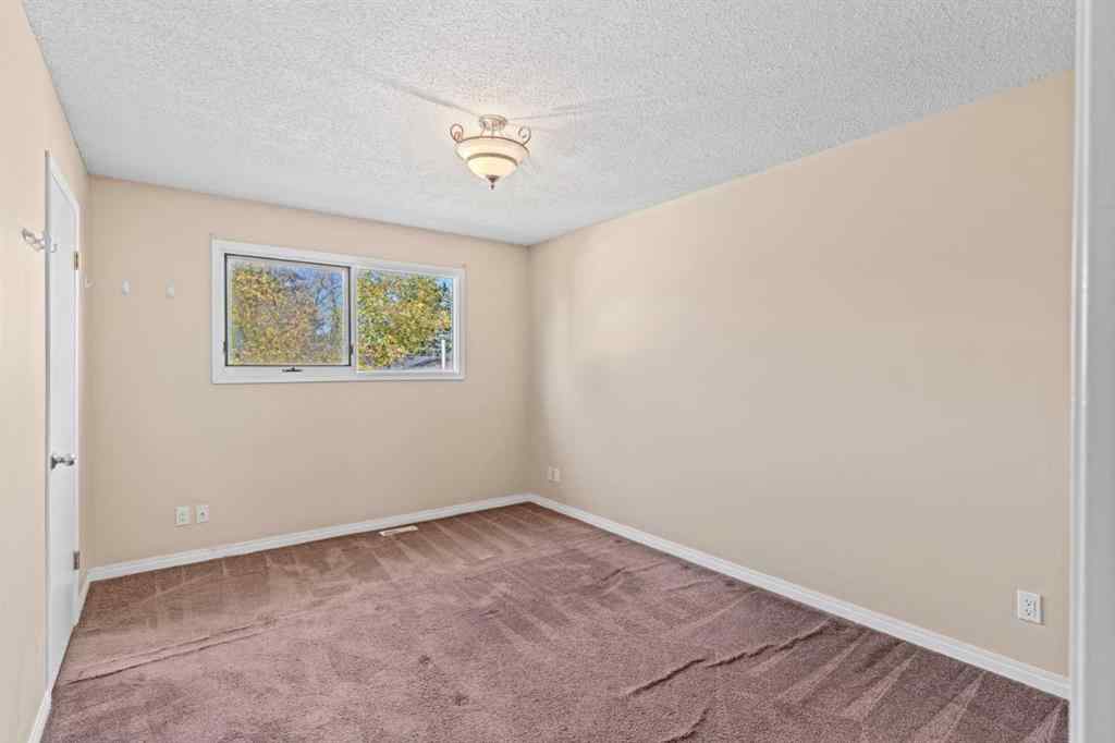 MLS® A2258825 - 212 Queen Anne Road SE in Queensland Calgary, Residential