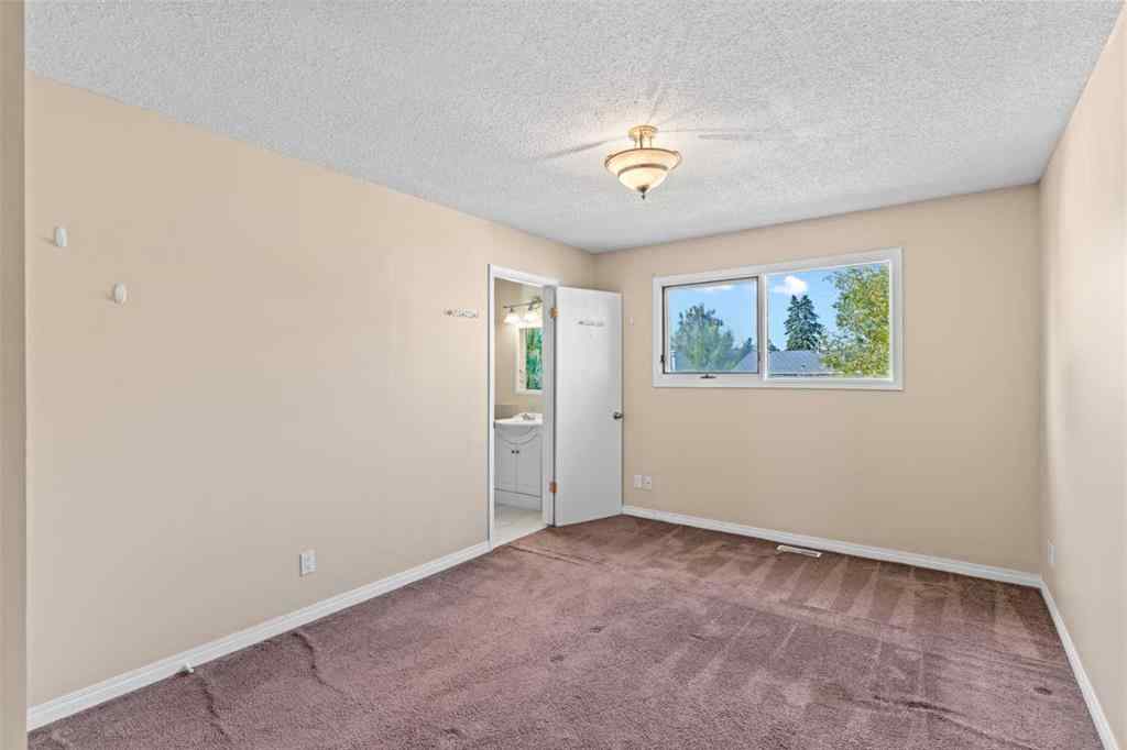 MLS® A2258825 - 212 Queen Anne Road SE in Queensland Calgary, Residential